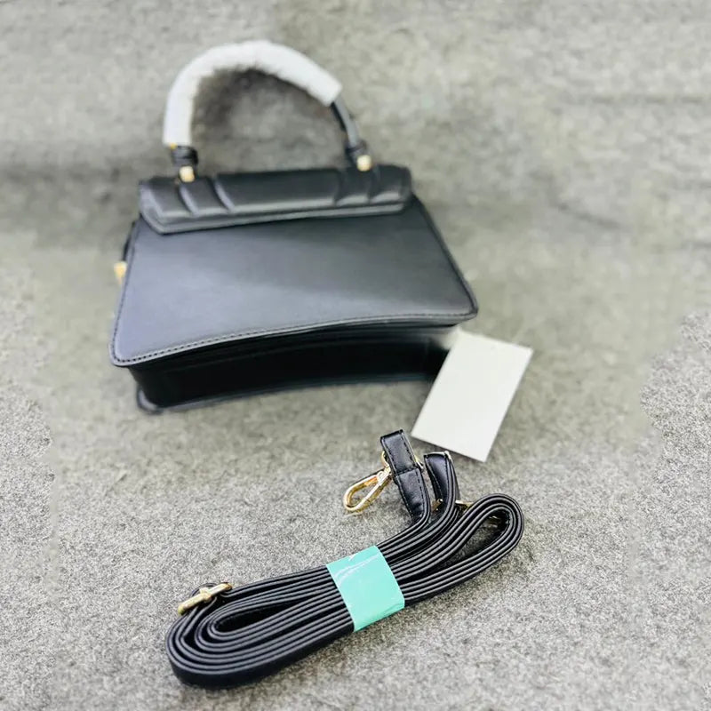 Quilted Black Leather Handbag with Gold-tone M Logo and Detachable Strap