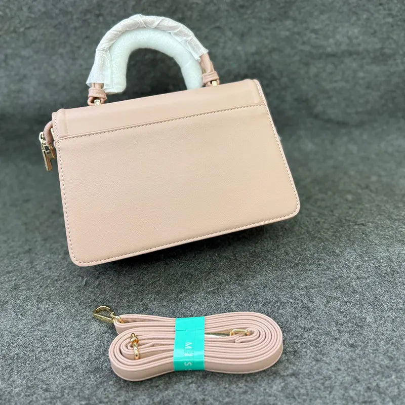 Imported Elegant Pink Leather Handbag with Gold Accents