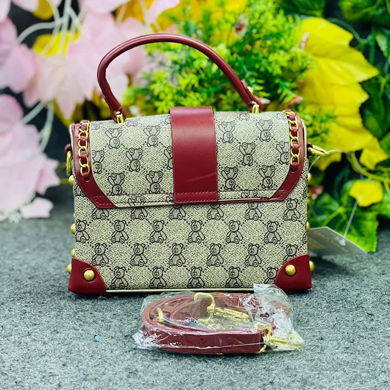 Luxury Monogrammed Handbag with Burgundy Accents & Gold Stud Detailing