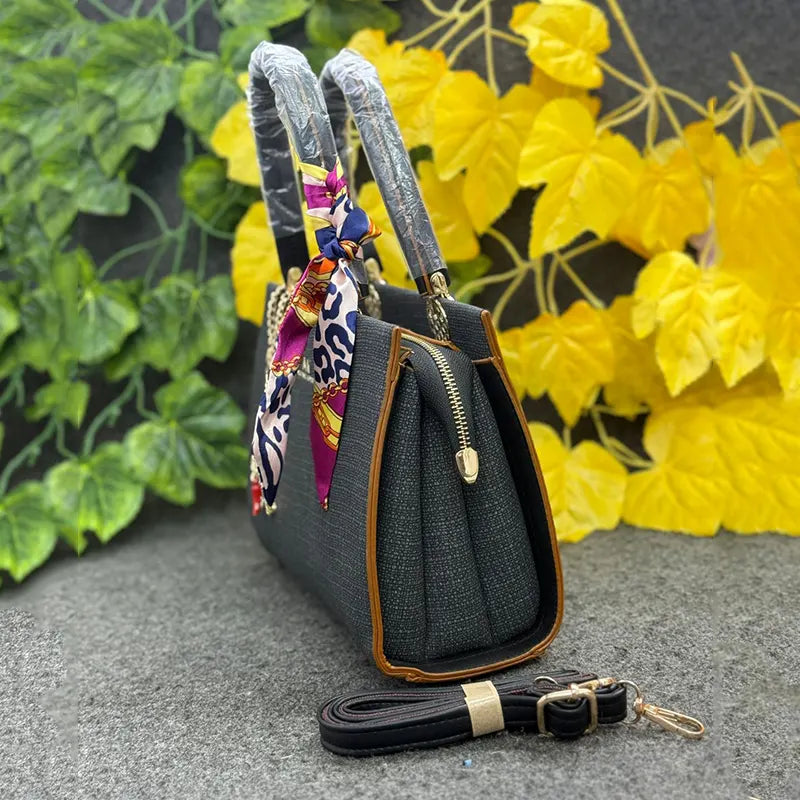 Classy Black Textured Handbag with Printed Scarf & Star Charm