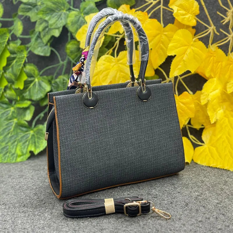 Classy Black Textured Handbag with Printed Scarf & Star Charm