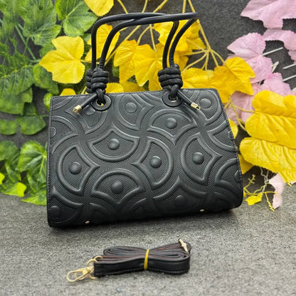 Elegant Embossed Classic Black Handbag with Knotted Handles