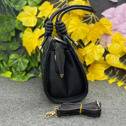 Elegant Embossed Classic Black Handbag with Knotted Handles