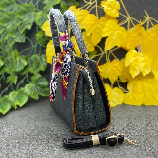 Classy Black Textured Handbag with Printed Scarf & Star Charm
